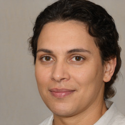 Joyful white adult female with medium  brown hair and brown eyes