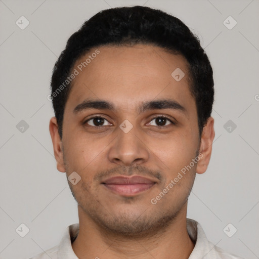 Joyful latino young-adult male with short  black hair and brown eyes