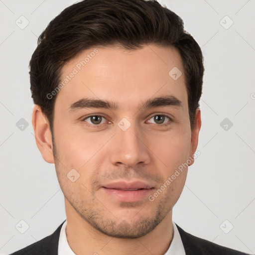 Joyful white young-adult male with short  brown hair and brown eyes