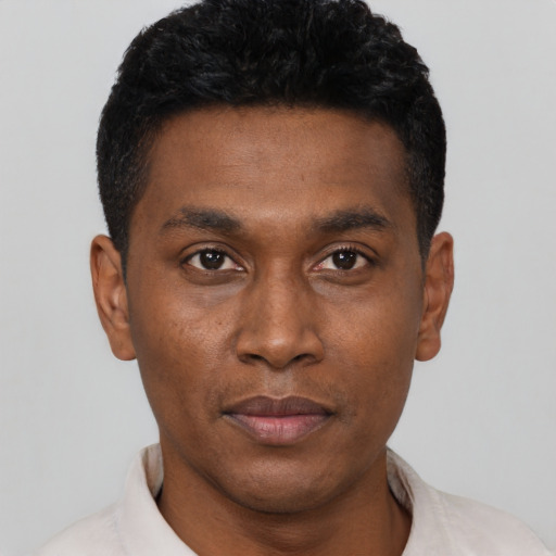 Neutral black young-adult male with short  black hair and brown eyes