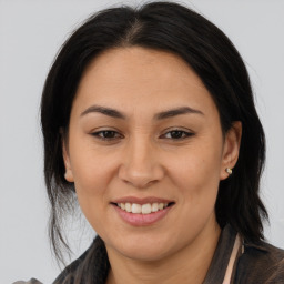 Joyful asian young-adult female with medium  brown hair and brown eyes