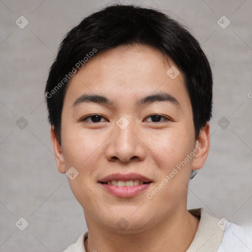 Joyful asian young-adult male with short  black hair and brown eyes