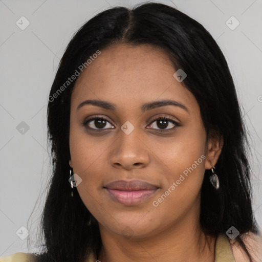 Joyful black young-adult female with long  black hair and brown eyes