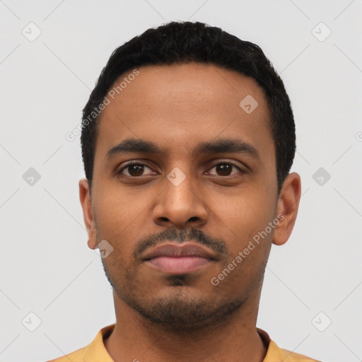 Neutral latino young-adult male with short  black hair and brown eyes