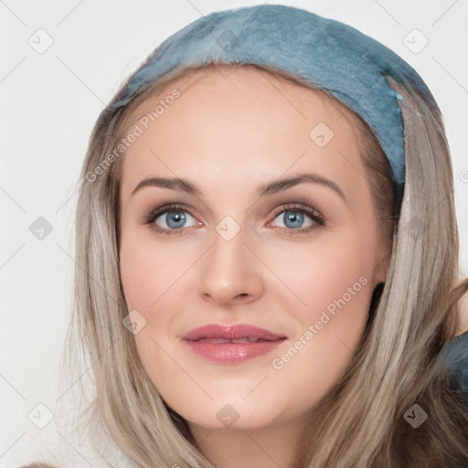 Joyful white young-adult female with long  brown hair and blue eyes