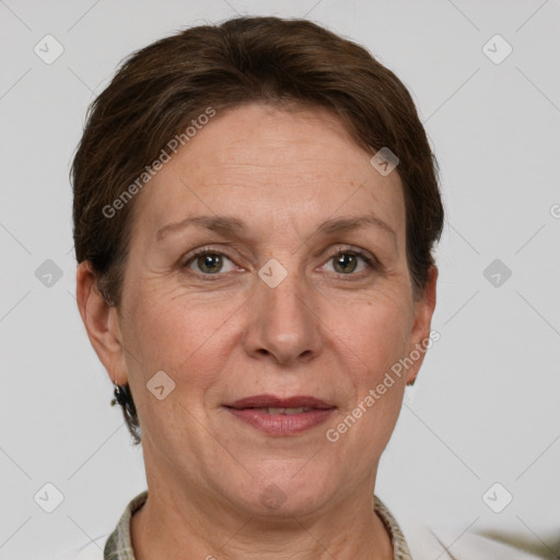 Joyful white adult female with short  brown hair and grey eyes