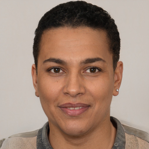 Joyful white adult male with short  black hair and brown eyes