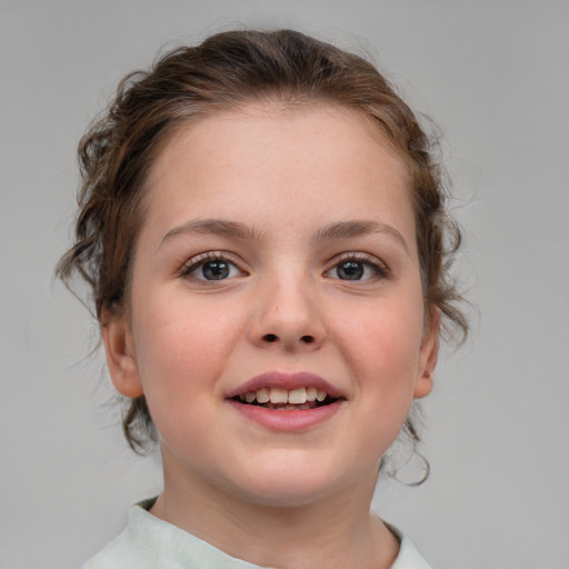 Joyful white child female with medium  brown hair and blue eyes