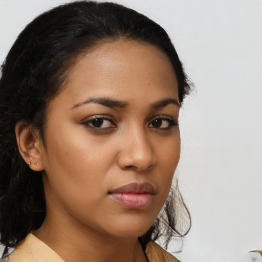 Neutral latino young-adult female with medium  brown hair and brown eyes