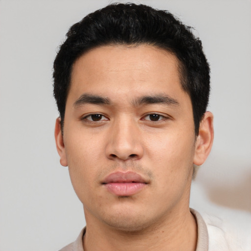 Neutral white young-adult male with short  black hair and brown eyes