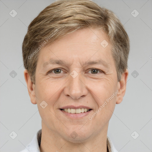 Joyful white adult male with short  brown hair and grey eyes