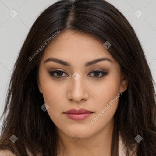 Joyful latino young-adult female with long  brown hair and brown eyes