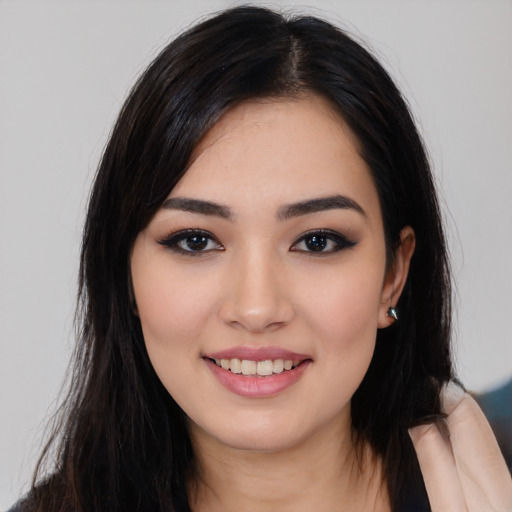 Joyful white young-adult female with long  black hair and brown eyes
