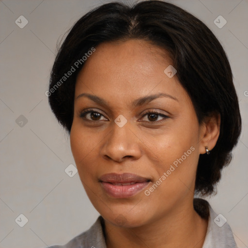 Joyful black young-adult female with medium  brown hair and brown eyes