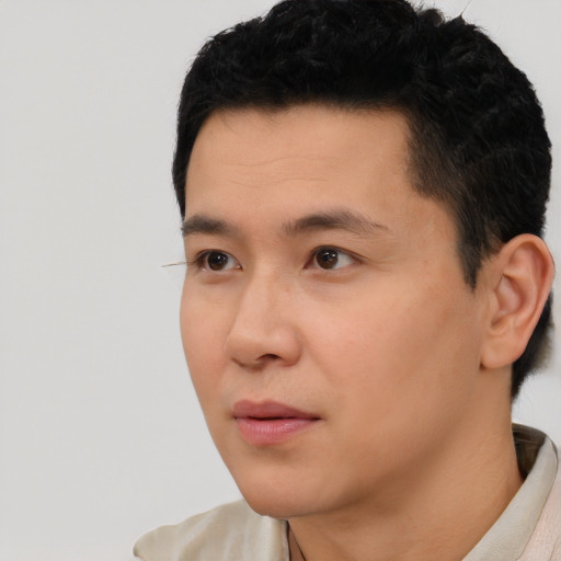 Neutral asian young-adult male with short  black hair and brown eyes