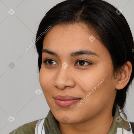 Joyful asian young-adult female with medium  brown hair and brown eyes