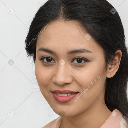 Joyful latino young-adult female with medium  brown hair and brown eyes