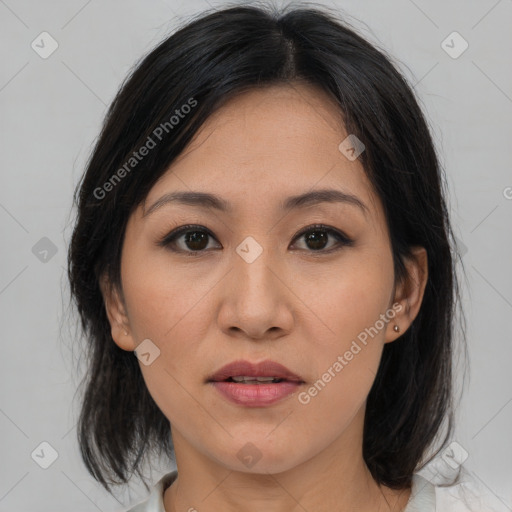 Joyful asian young-adult female with medium  brown hair and brown eyes