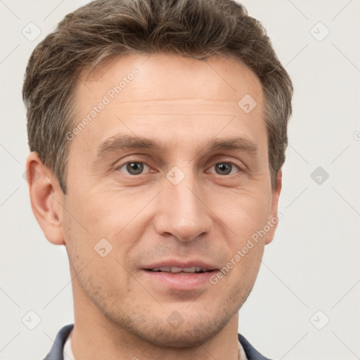 Joyful white adult male with short  brown hair and brown eyes