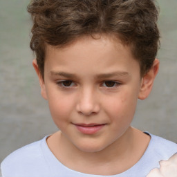 Joyful white child male with short  brown hair and brown eyes