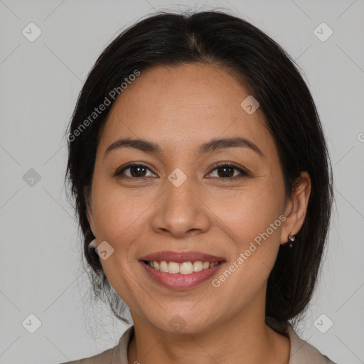 Joyful white adult female with medium  brown hair and brown eyes