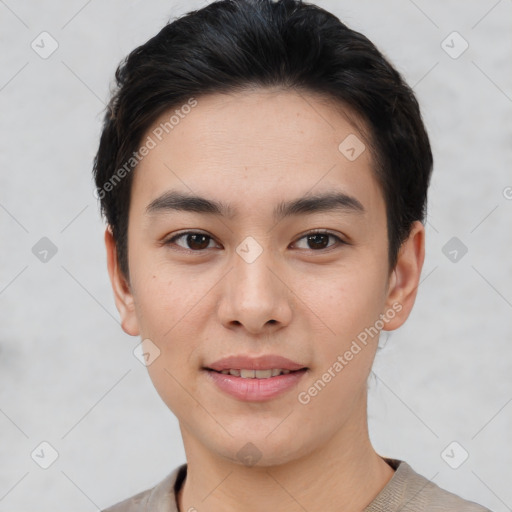 Joyful white young-adult male with short  black hair and brown eyes