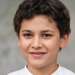 Joyful white child male with short  brown hair and brown eyes