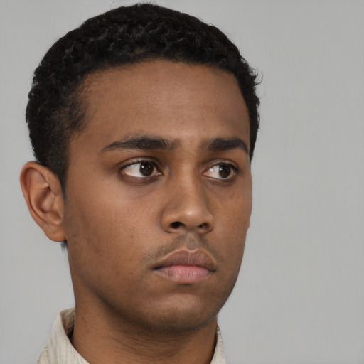 Neutral black young-adult male with short  black hair and brown eyes