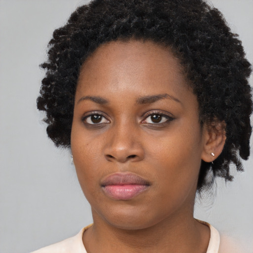 Neutral black young-adult female with short  black hair and brown eyes