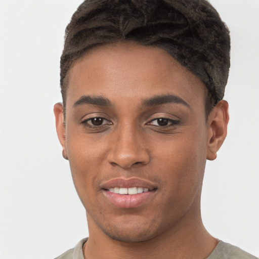 Joyful black young-adult male with short  brown hair and brown eyes