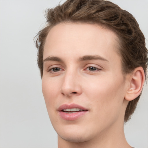 Joyful white young-adult female with medium  brown hair and green eyes