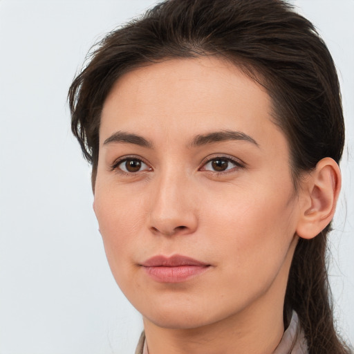 Neutral white young-adult female with long  brown hair and brown eyes