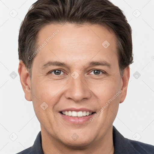 Joyful white adult male with short  brown hair and brown eyes