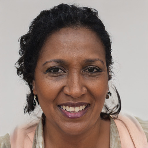 Joyful latino adult female with short  brown hair and brown eyes