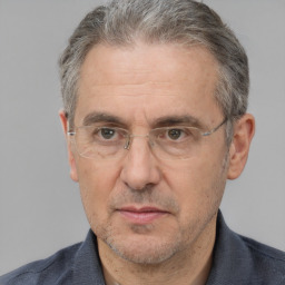 Neutral white middle-aged male with short  gray hair and brown eyes