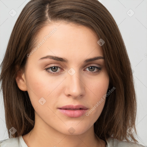 Neutral white young-adult female with medium  brown hair and brown eyes