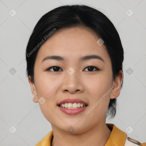 Joyful asian young-adult female with short  black hair and brown eyes