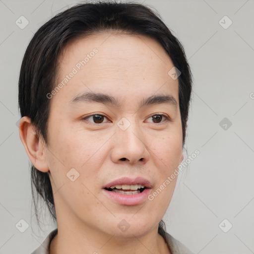 Joyful asian young-adult male with short  brown hair and brown eyes