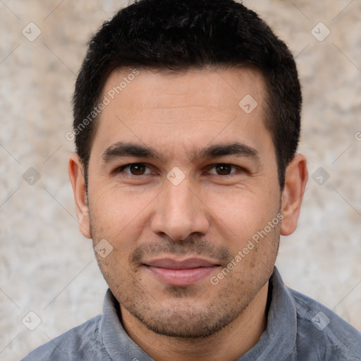 Joyful white young-adult male with short  black hair and brown eyes