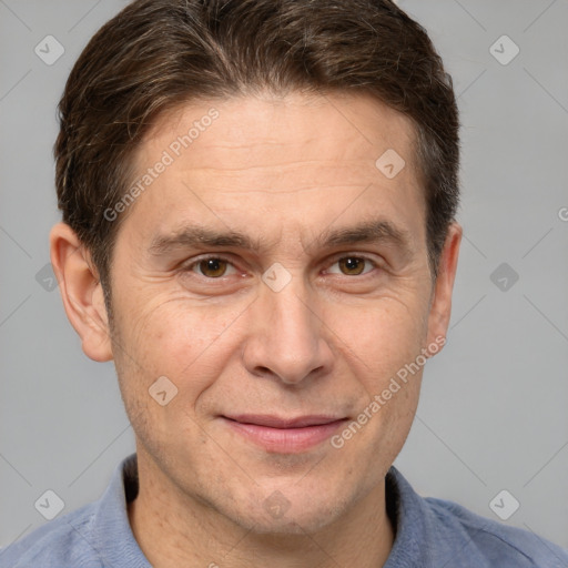 Joyful white adult male with short  brown hair and grey eyes