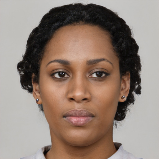 Neutral black young-adult female with short  black hair and brown eyes