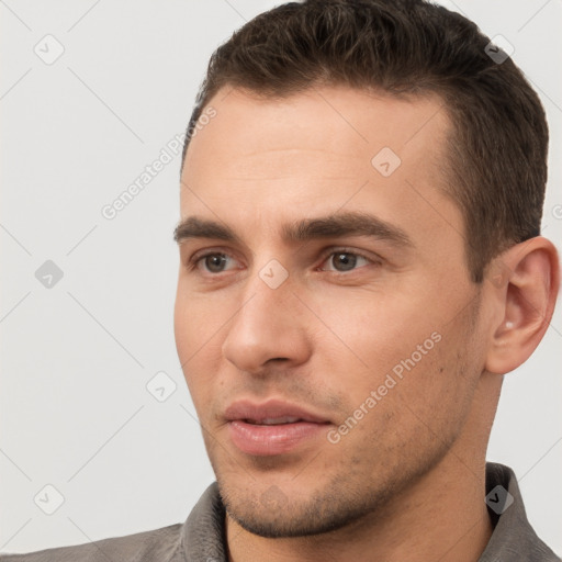 Neutral white young-adult male with short  brown hair and brown eyes