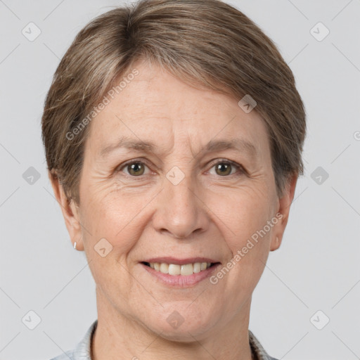 Joyful white adult female with short  brown hair and grey eyes