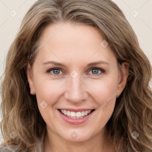 Joyful white young-adult female with long  brown hair and green eyes