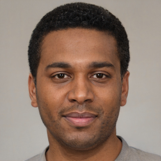 Neutral black young-adult male with short  brown hair and brown eyes
