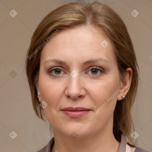 Joyful white adult female with medium  brown hair and grey eyes