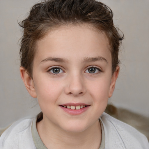 Joyful white child female with short  brown hair and brown eyes