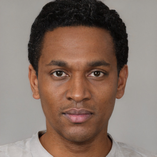 Neutral black young-adult male with short  black hair and brown eyes