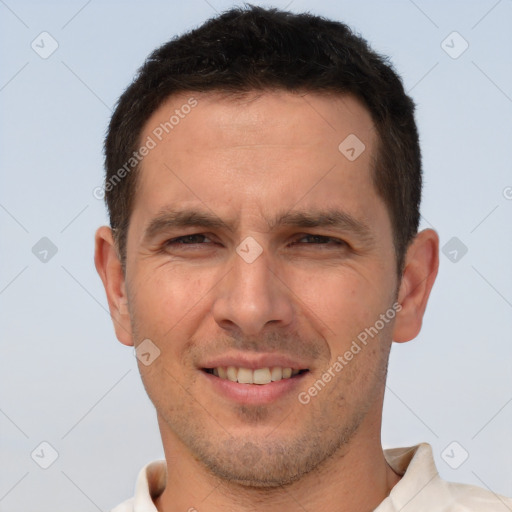 Joyful white adult male with short  brown hair and brown eyes