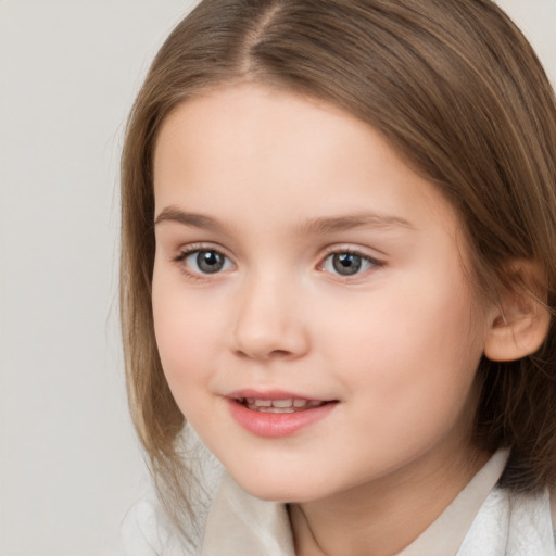 Joyful white child female with medium  brown hair and brown eyes